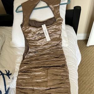 Beautiful cocktail dress silvery gold in color. New Nicole Miller